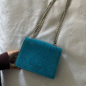 Blue mini bag. (8/10) Great condition. Comes with dust bag and box.